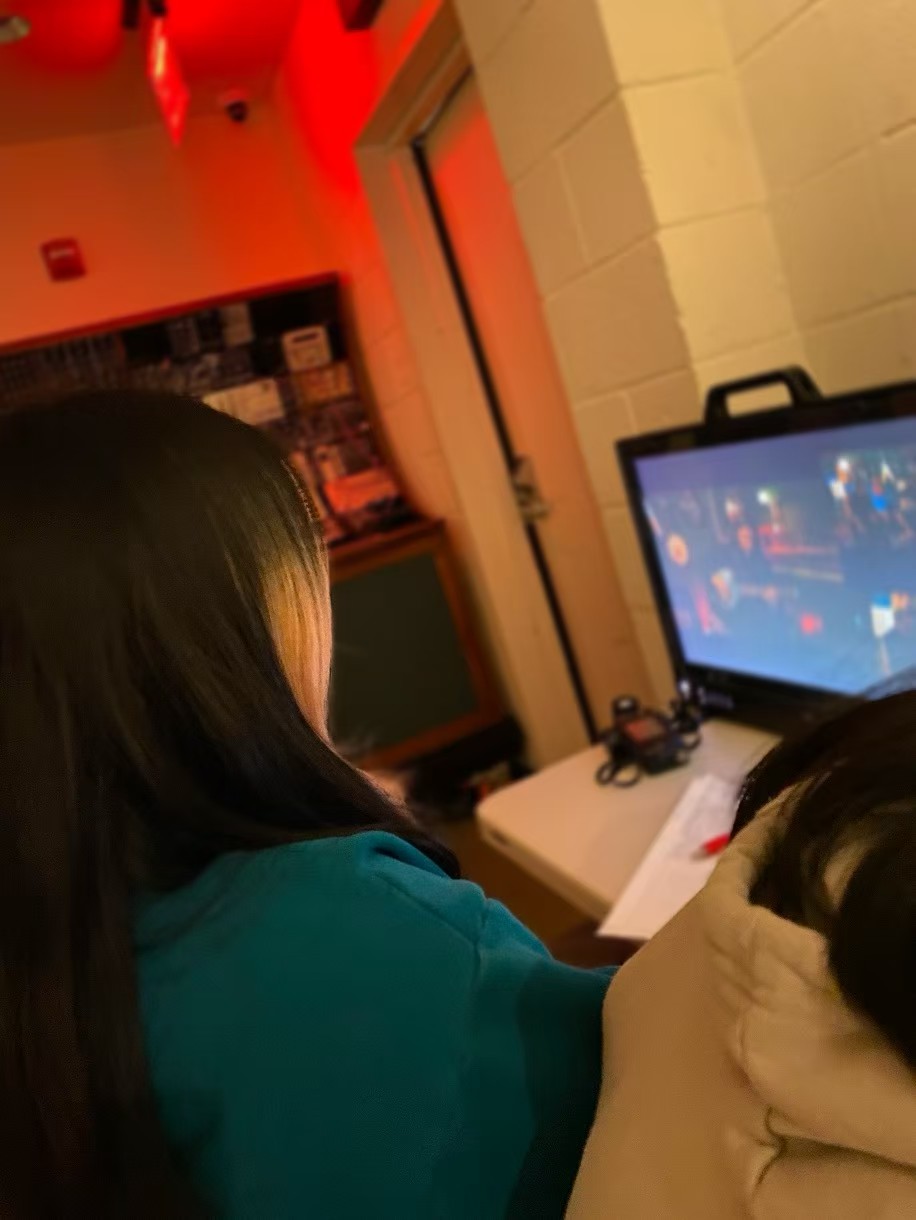 Watching the production monitor behind the scenes