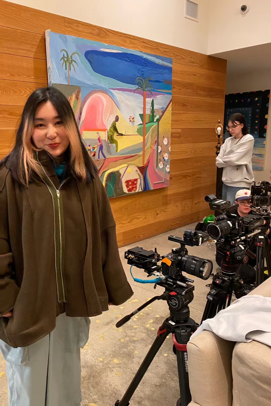 Faith on set beside the production cameras